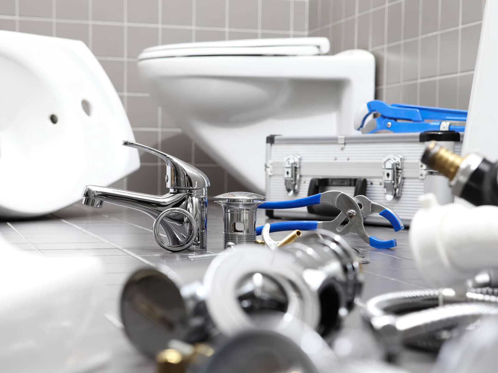 JB M&E SERVICES technicians repairing plumbing